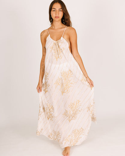 White Maxi Dress with a Collar, Open Back, and Gold Coral Accents