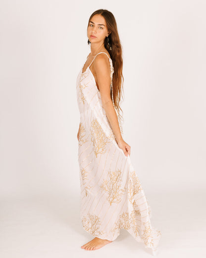 White Maxi Dress with a Collar, Open Back, and Gold Coral Accents