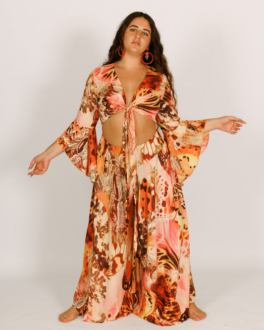 Wrap-around crop top with orange butterflies, wide bell sleeves