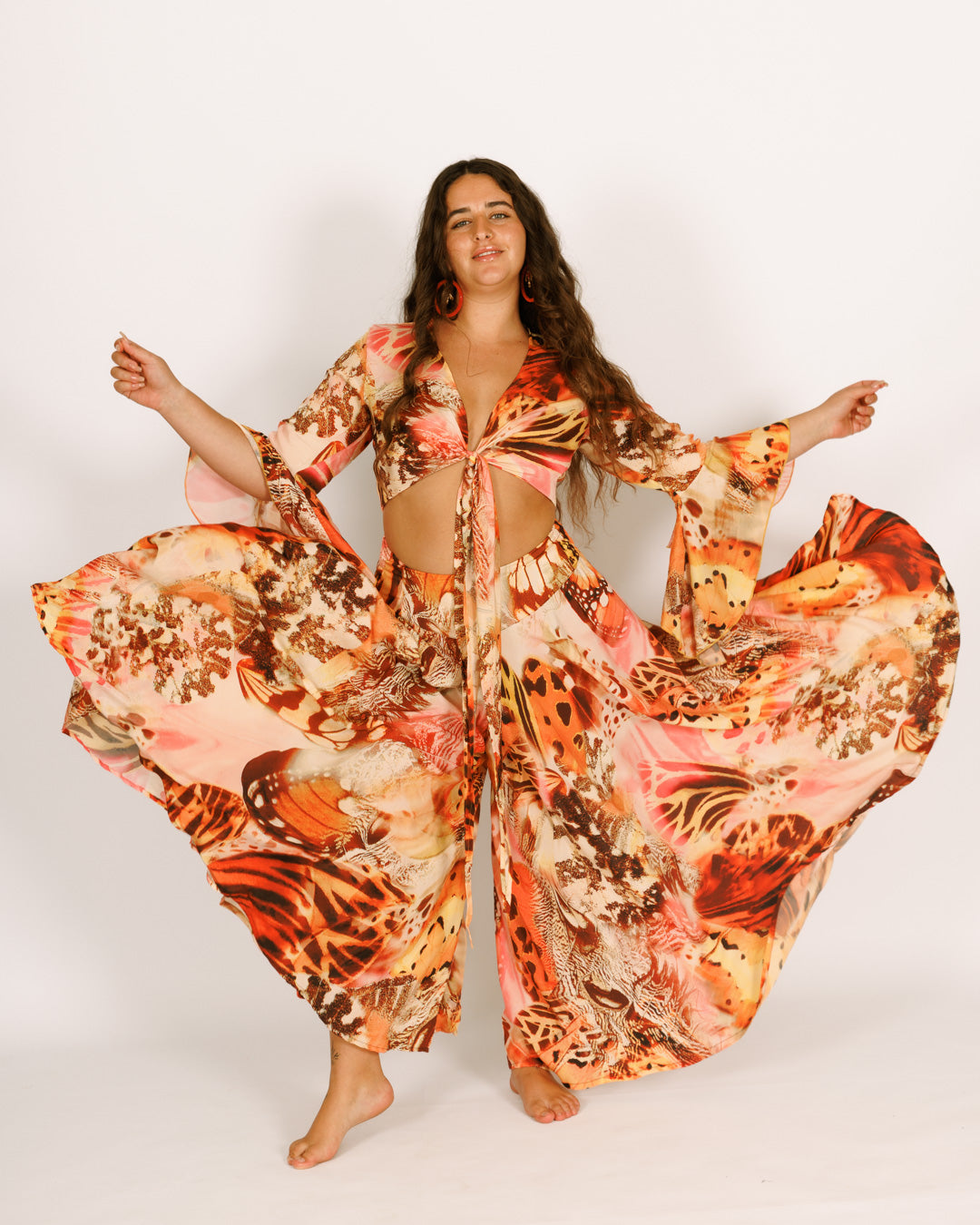 Wrap-around crop top with orange butterflies, wide bell sleeves