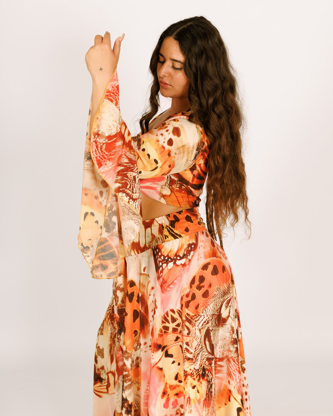 Wrap-around crop top with orange butterflies, wide bell sleeves