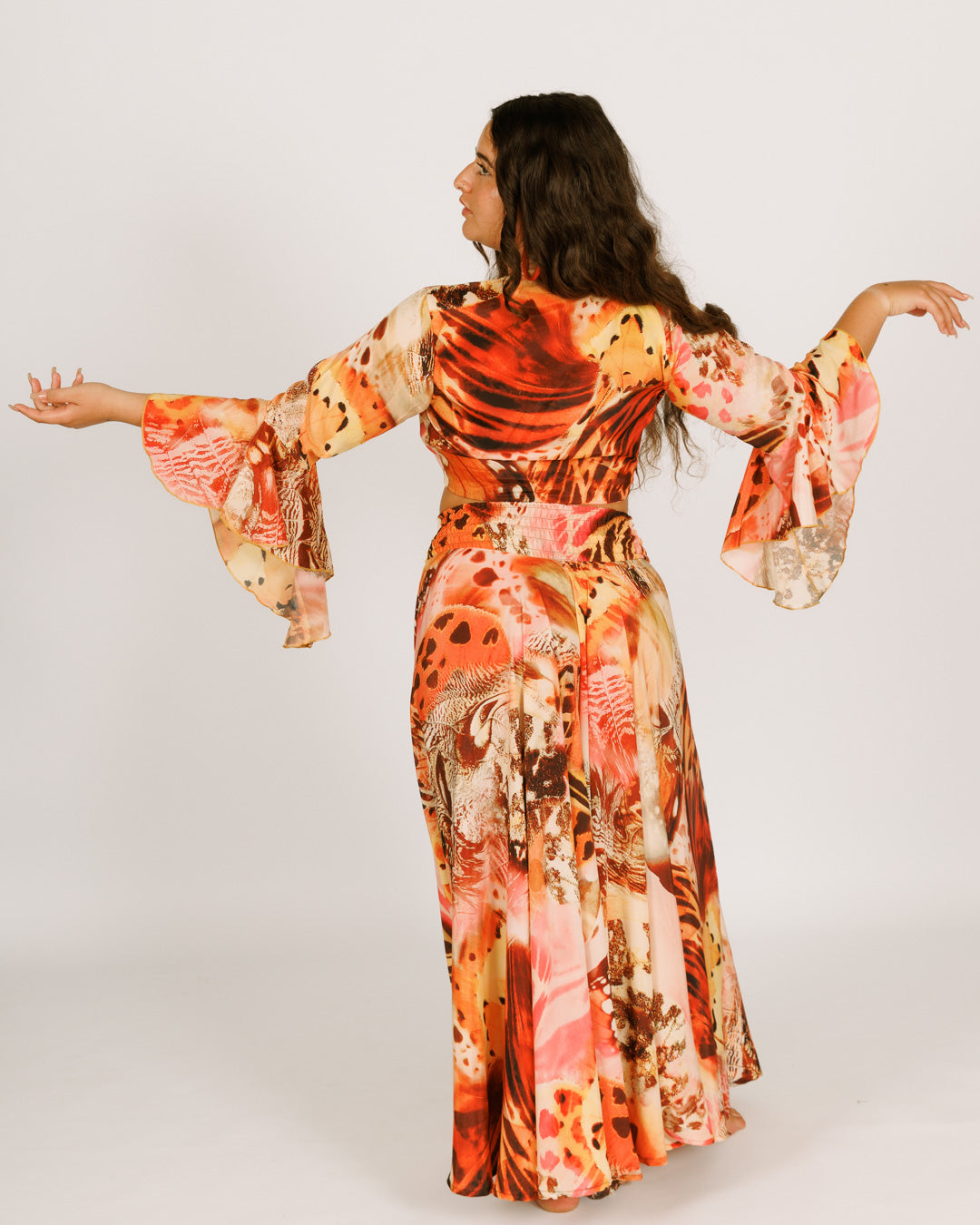 Wrap-around crop top with orange butterflies, wide bell sleeves