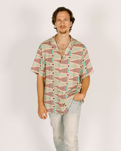 Short viscose button-up shirt for men - pink with triangular patterns in blue