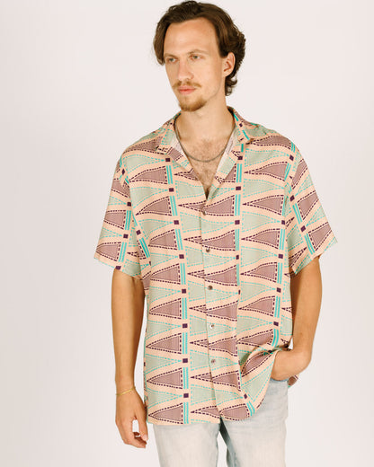 Short viscose button-up shirt for men - pink with triangular patterns in blue