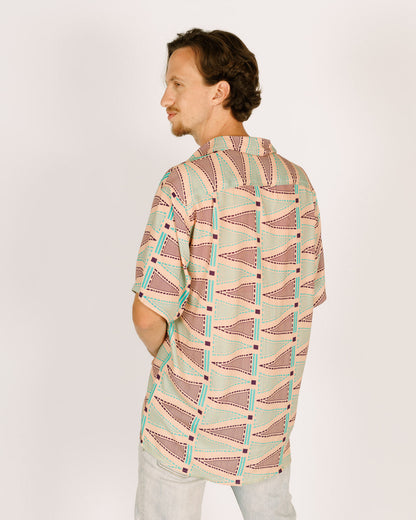 Short viscose button-up shirt for men - pink with triangular patterns in blue